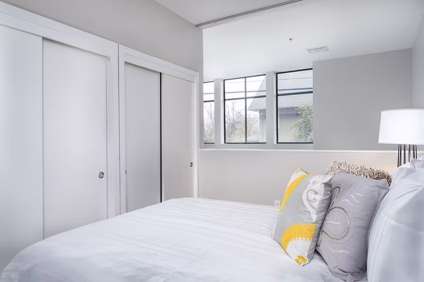 Cozy bedroom with modern furnishings at Park 19 Apartments, offering luxury living in a vibrant neighborhood