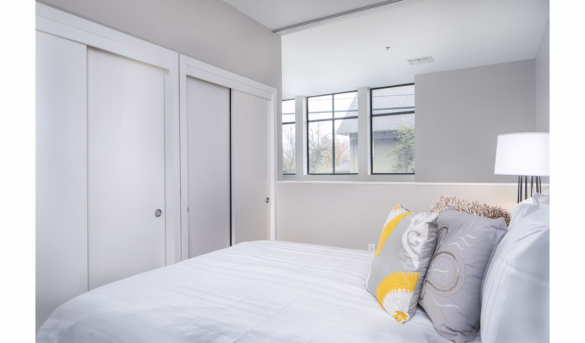 Cozy bedroom with modern furnishings at Park 19 Apartments, offering luxury living in a vibrant neighborhood