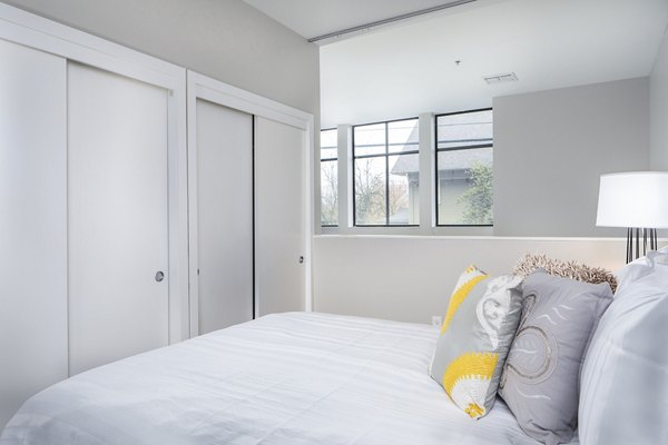 Cozy bedroom with modern furnishings at Park 19 Apartments, offering luxury living in a vibrant neighborhood