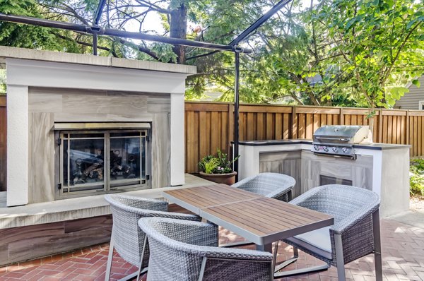 Outdoor grill area with sleek seating at Park 19 Apartments, offering luxury amenities in a vibrant community