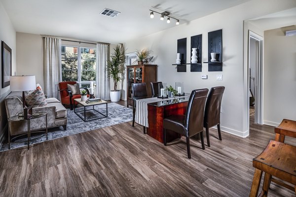 Elegant dining room with modern furnishings at Trio Apartments