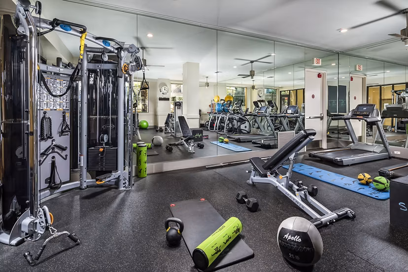 Modern fitness center with state-of-the-art equipment at Trio Apartments for an active lifestyle