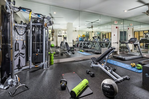 Modern fitness center with state-of-the-art equipment at Trio Apartments for an active lifestyle