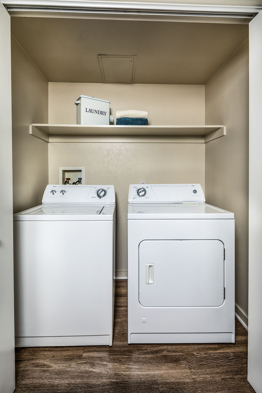 Laundry room at Trio Apartments