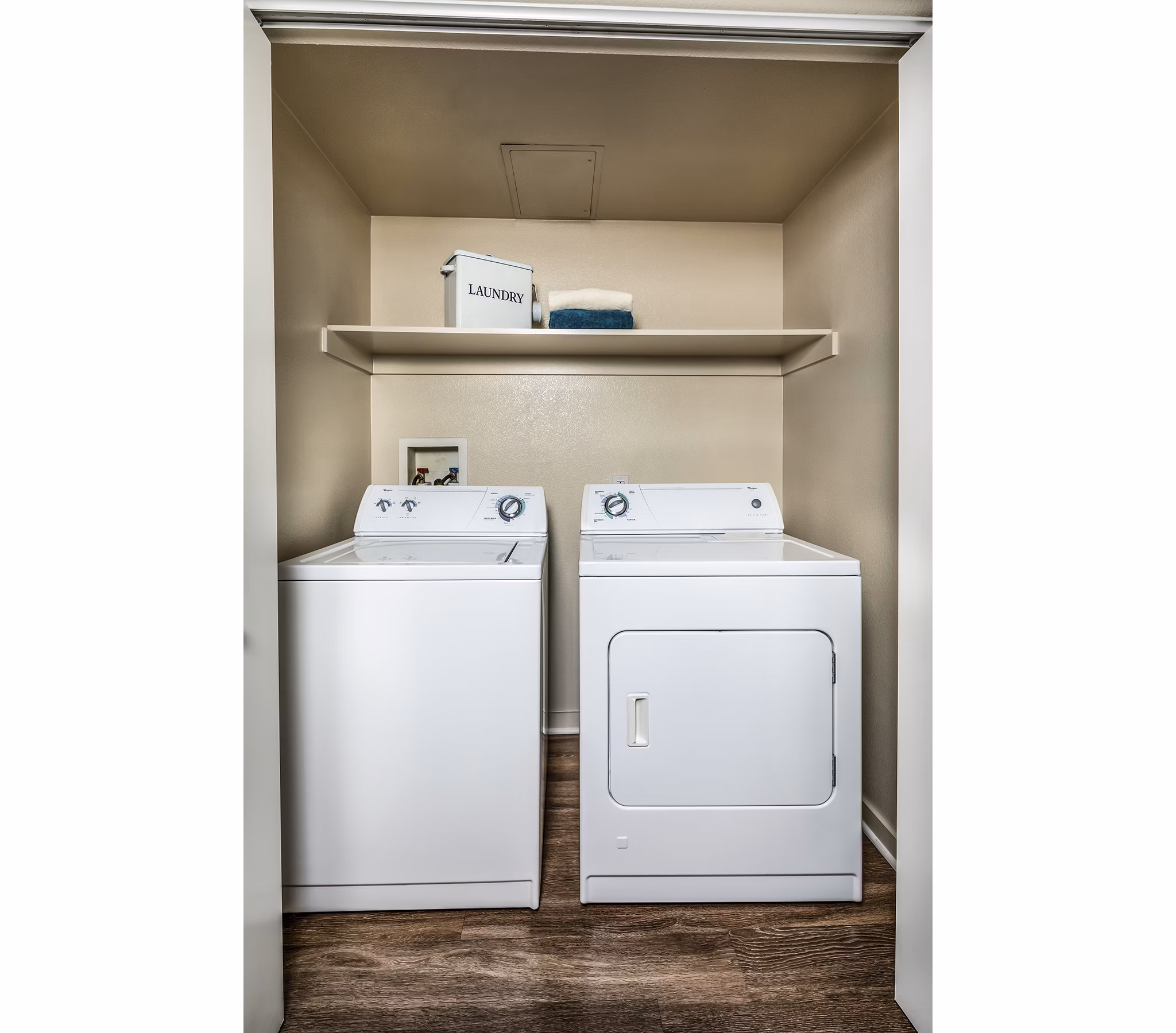 Laundry room with state-of-the-art appliances in Trio Apartments