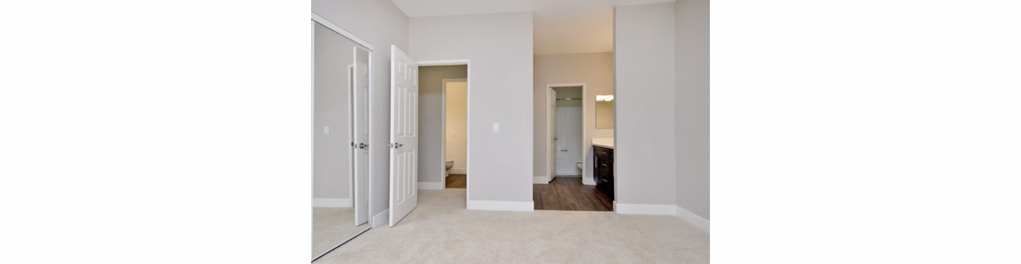 Cozy bedroom with modern furnishings in Westcreek Apartments, a Greystar luxury community in an urban setting
