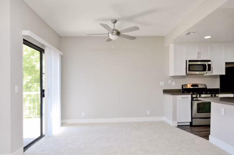 Dining room featuring a sleek dining table and contemporary lighting in Westcreek Apartments