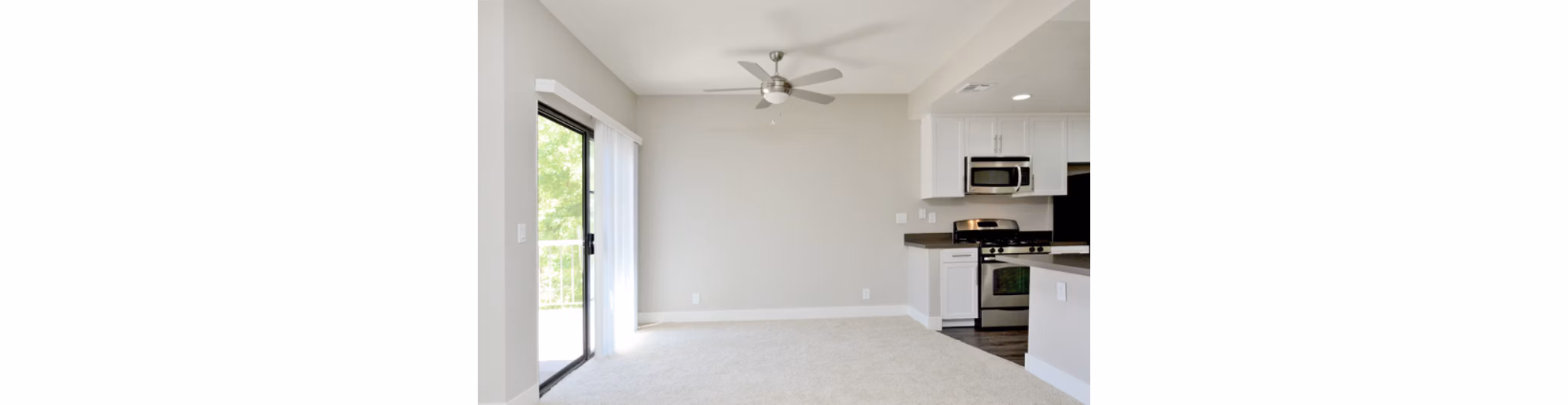 Dining room featuring a sleek dining table and contemporary lighting in Westcreek Apartments