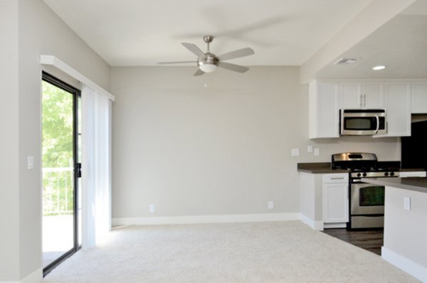 Dining room featuring a sleek dining table and contemporary lighting in Westcreek Apartments