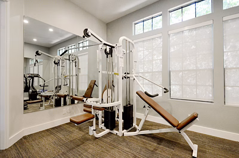 Fitness center with modern equipment at Westcreek Apartments