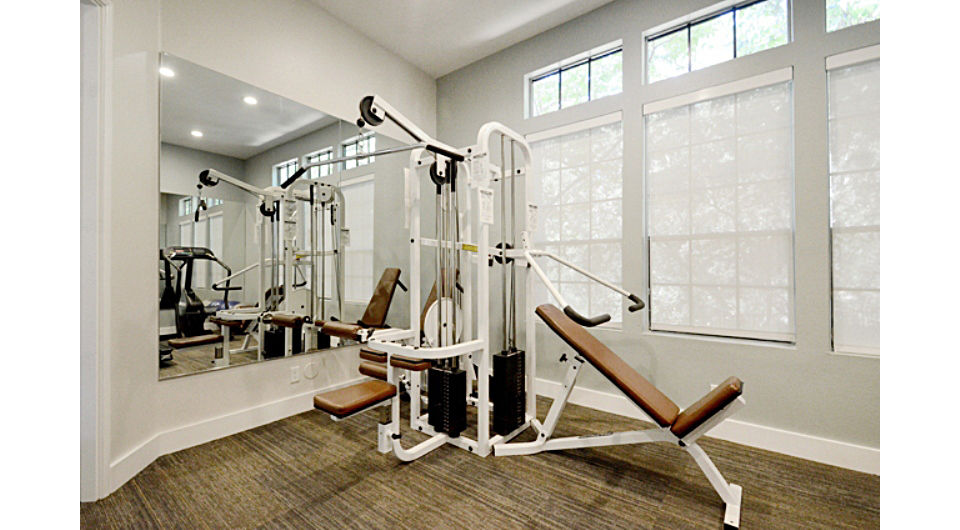 Fitness center with modern equipment at Westcreek Apartments