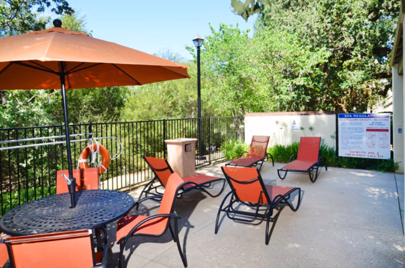 Elegant patio with stylish outdoor seating at Westcreek Apartments, offering a luxurious living experience