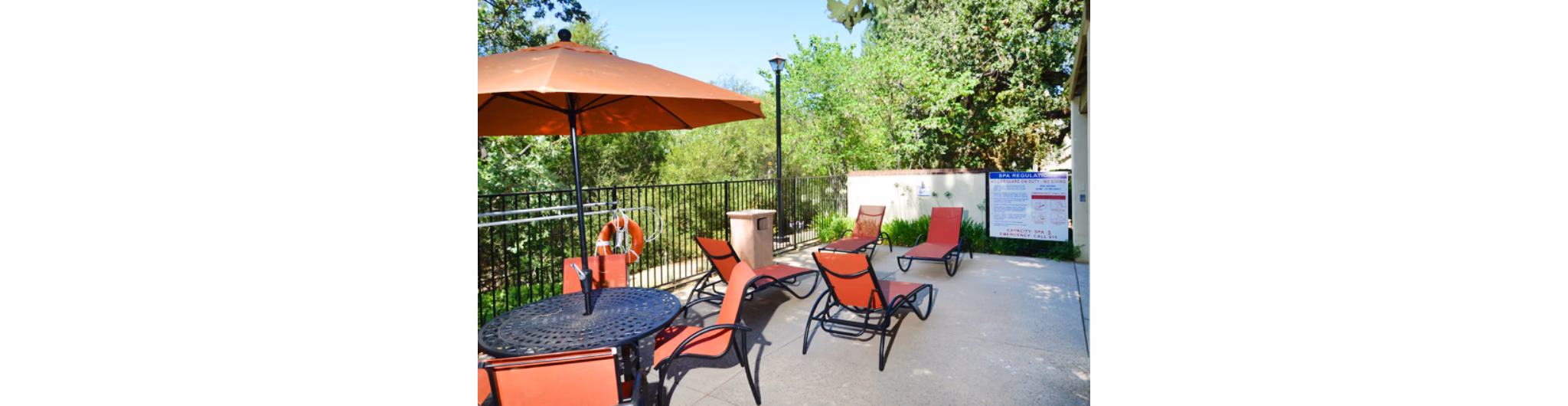 Elegant patio with stylish outdoor seating at Westcreek Apartments, offering a luxurious living experience