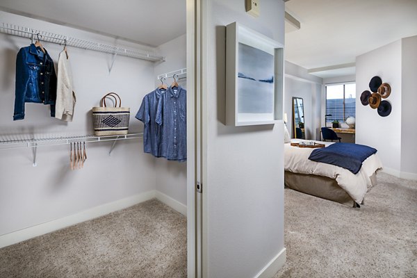 Spacious bedroom closet with mirrored sliding doors at Legacy at Westwood Apartments