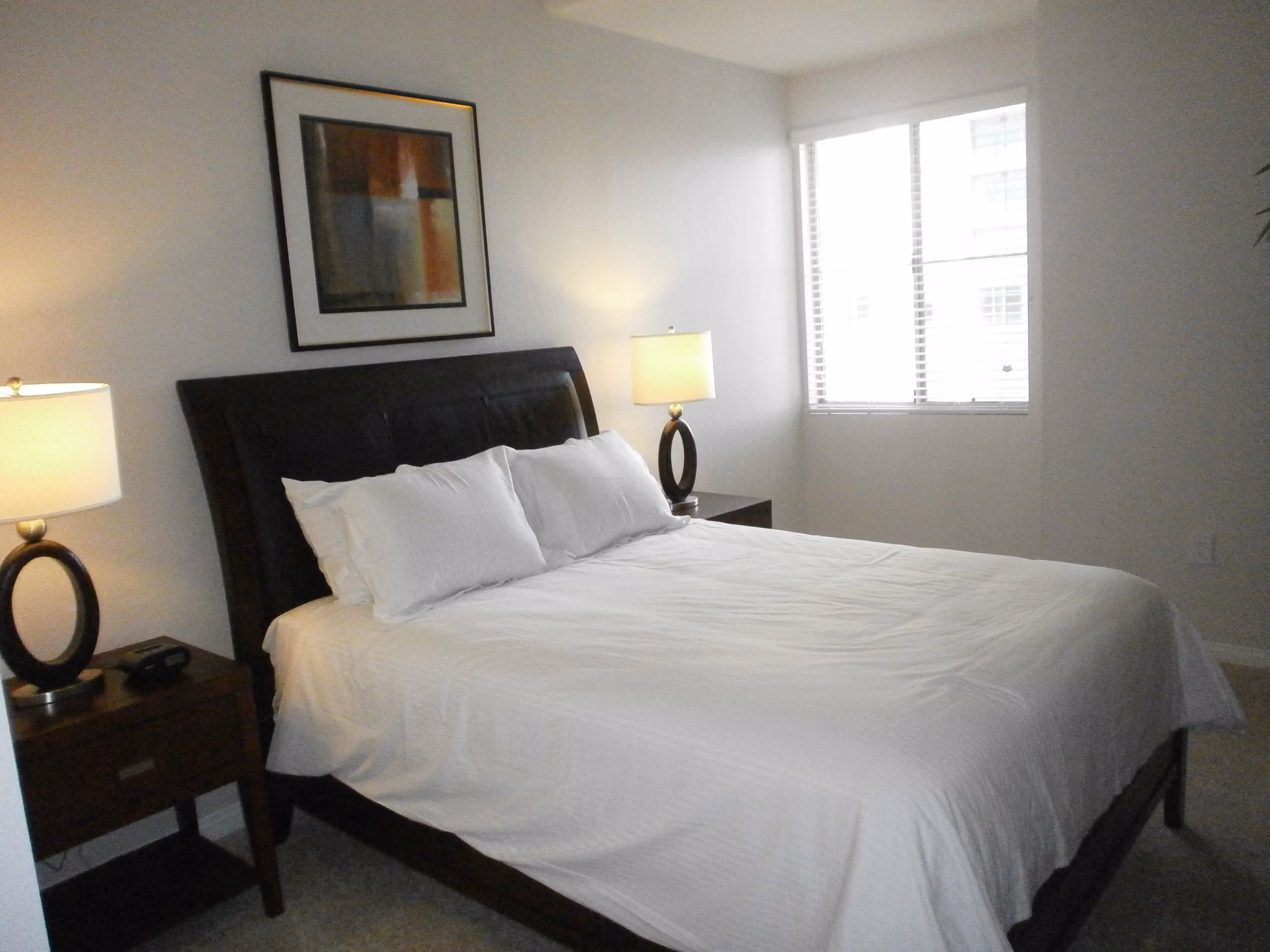 Bedroom with modern furnishings and natural light in Legacy at Westwood Apartments, luxurious living in a Greystar community