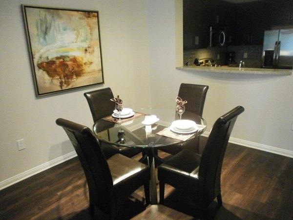 Modern dining room with elegant lighting and sleek furniture in Legacy at Westwood Apartments
