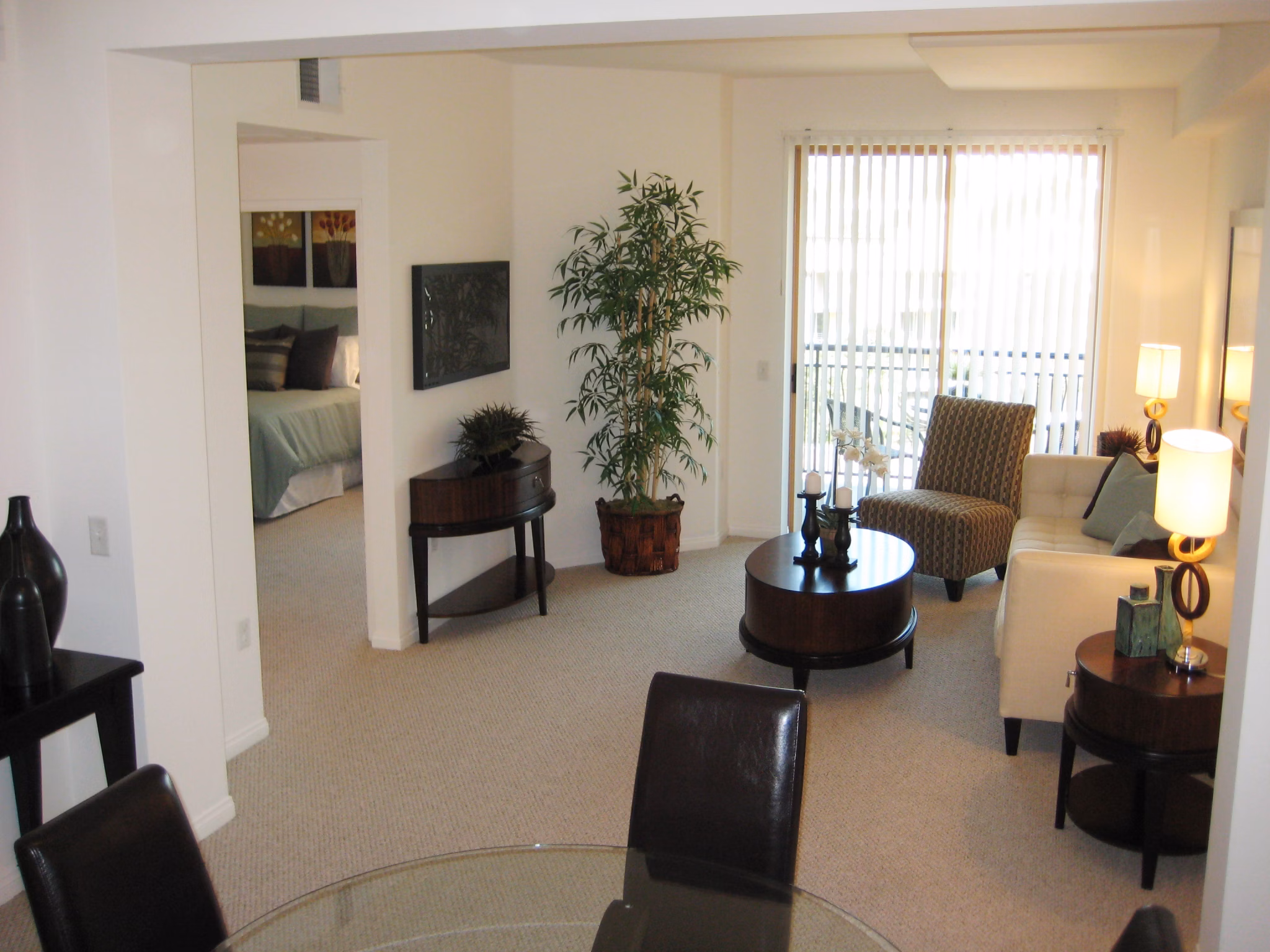 Living room with modern furnishings and large windows at Legacy at Westwood Apartments