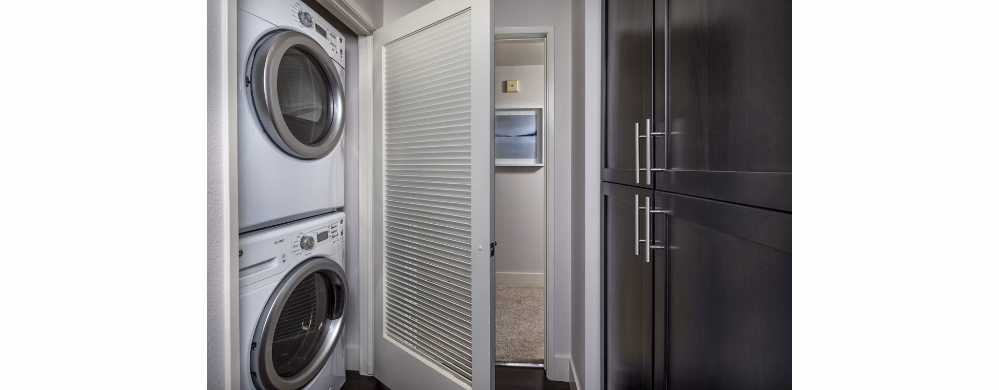 Laundry room featuring modern washers and dryers at Legacy at Westwood Apartments