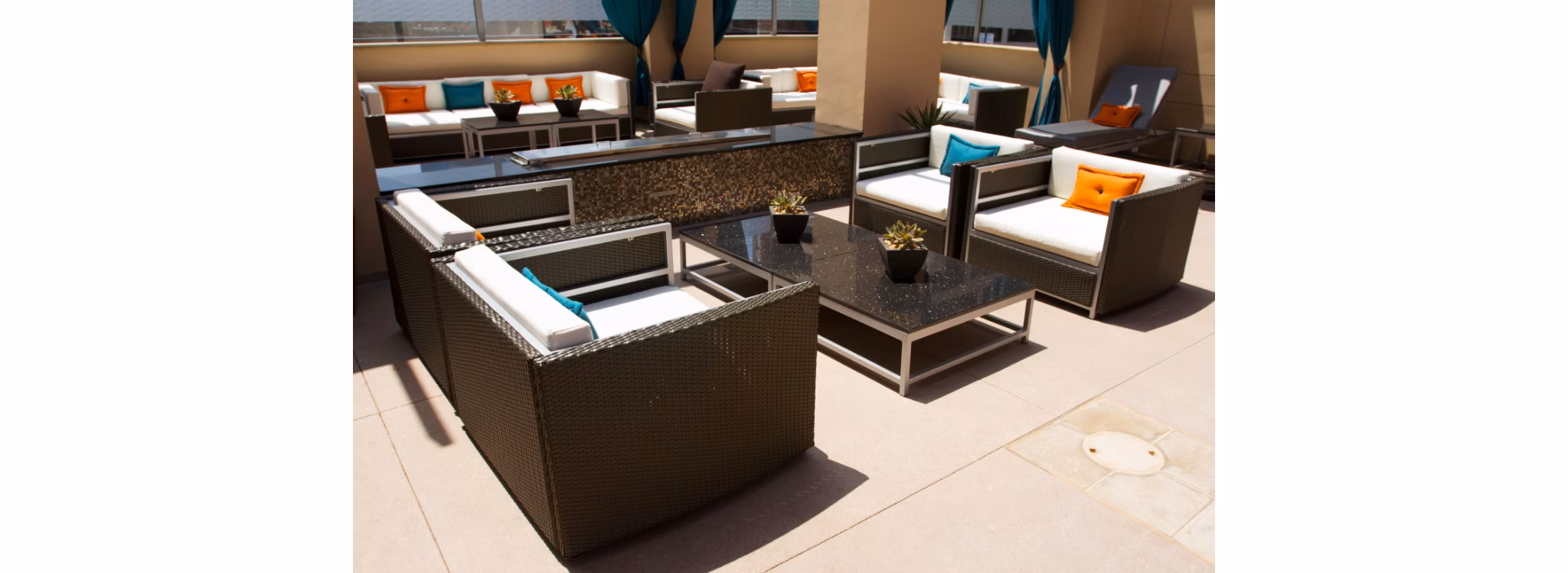 Patio with cozy seating and lush greenery at Legacy at Westwood Apartments, a luxury residential community in a prime location