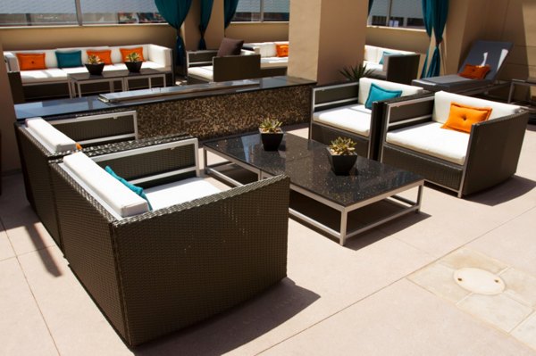 Patio with cozy seating and lush greenery at Legacy at Westwood Apartments, a luxury residential community in a prime location