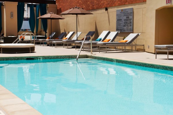 Resort-style pool at Legacy at Westwood Apartments, offering luxury amenities and outdoor lounging spaces for relaxation