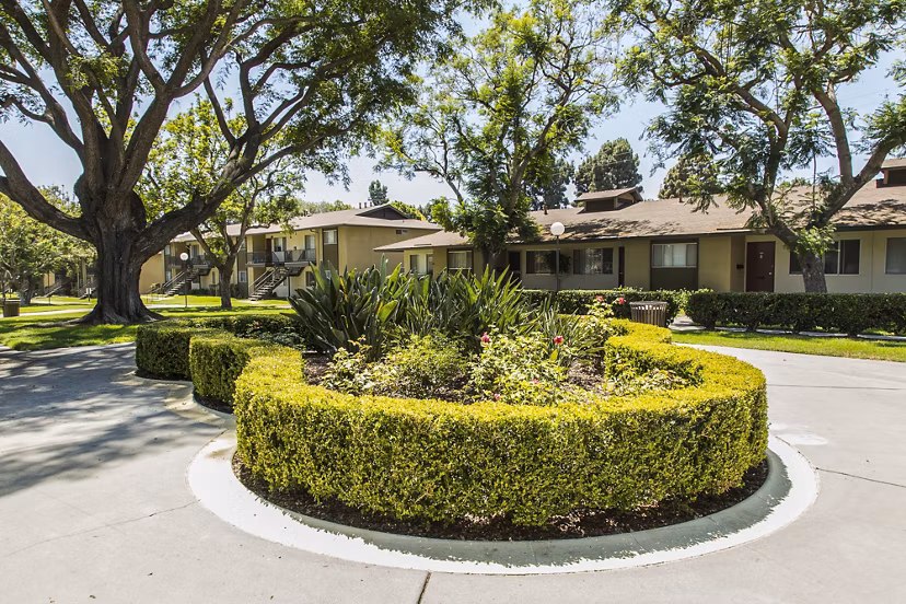Ventura Terrace Apartments: Tranquil courtyard with lush landscaping and seating areas