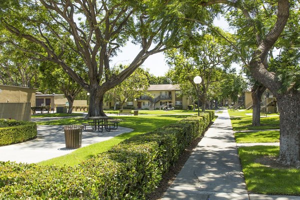 Landscaped courtyard with seating areas at Ventura Terrace Apartments