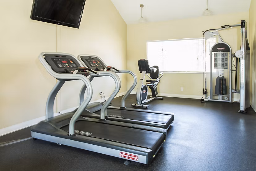 Fitness center equipped with modern exercise machines at Ventura Terrace Apartments