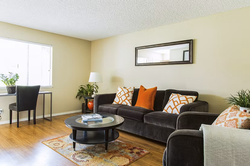 Spacious living room with modern decor and natural light in Ventura Terrace Apartments
