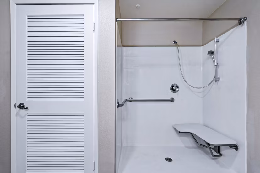 Modern bathroom with glass shower and sleek fixtures in Rolling Hills Gardens Apartments
