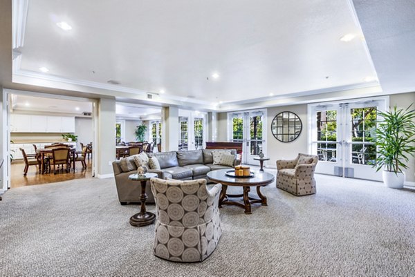 Clubhouse featuring modern design and cozy seating at Rolling Hills Gardens Apartments