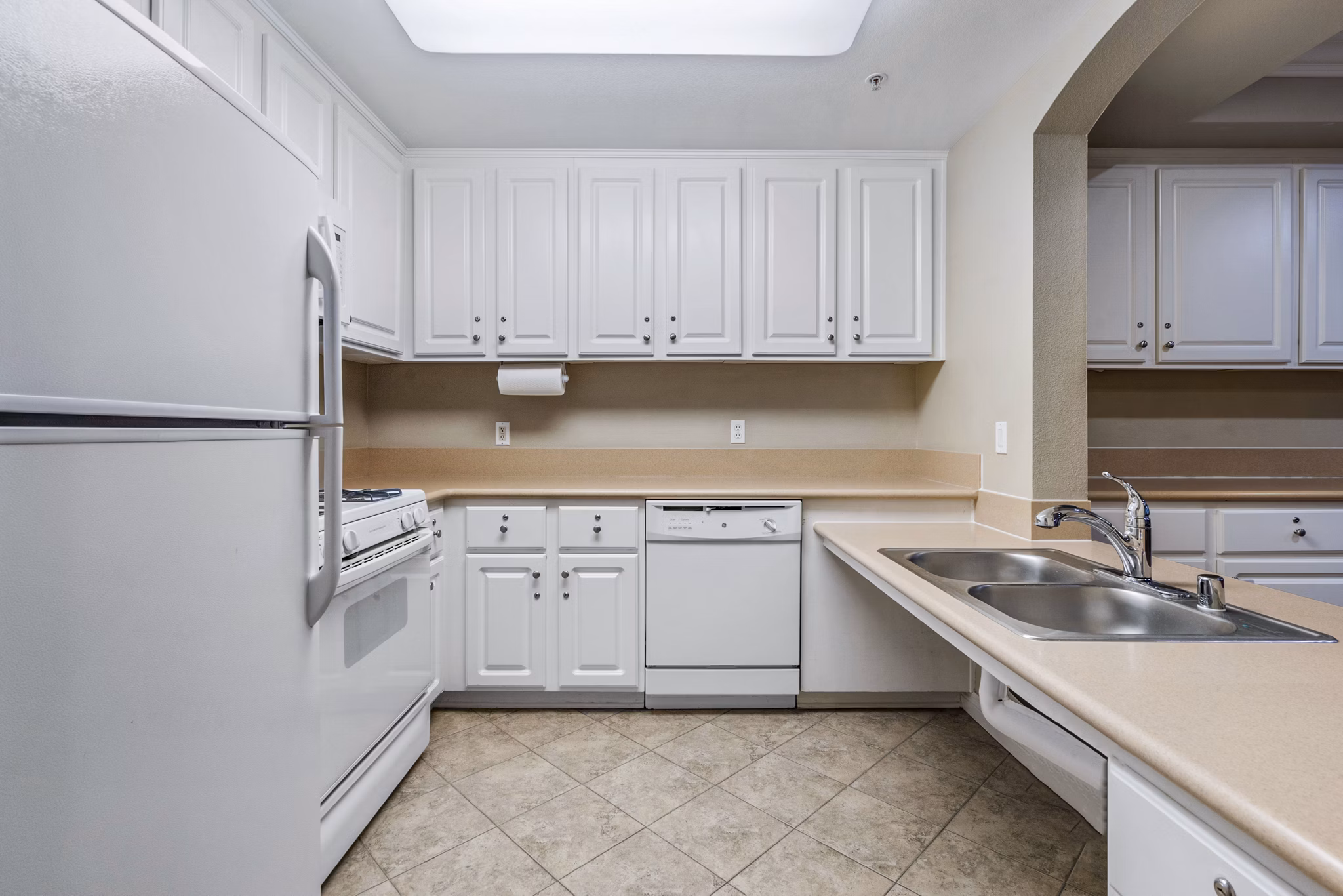 Clubhouse kitchen featuring stainless steel appliances and granite countertops at Rolling Hills Gardens Apartments, luxury living by Greystar