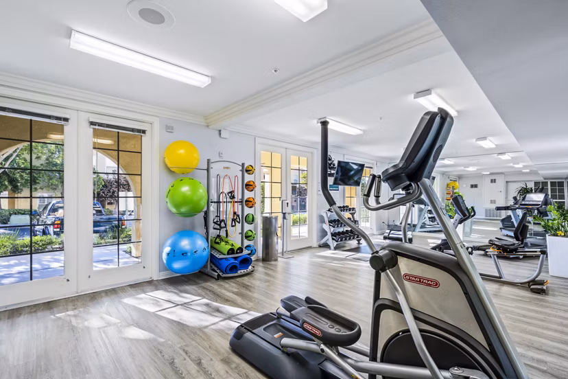 State-of-the-art fitness center with modern equipment at Rolling Hills Gardens Apartments, promoting an active lifestyle for residents