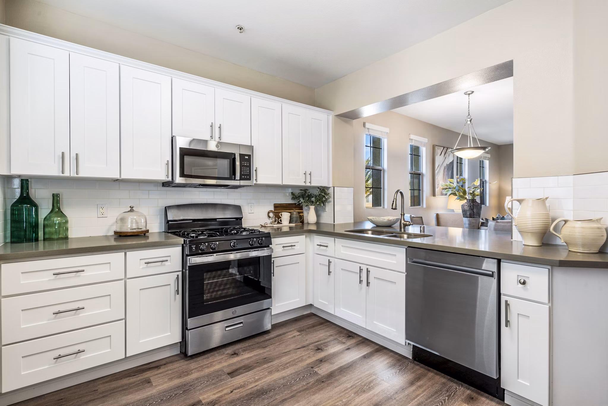 Modern kitchen with stainless steel appliances and granite countertops at Rolling Hills Gardens Apartments