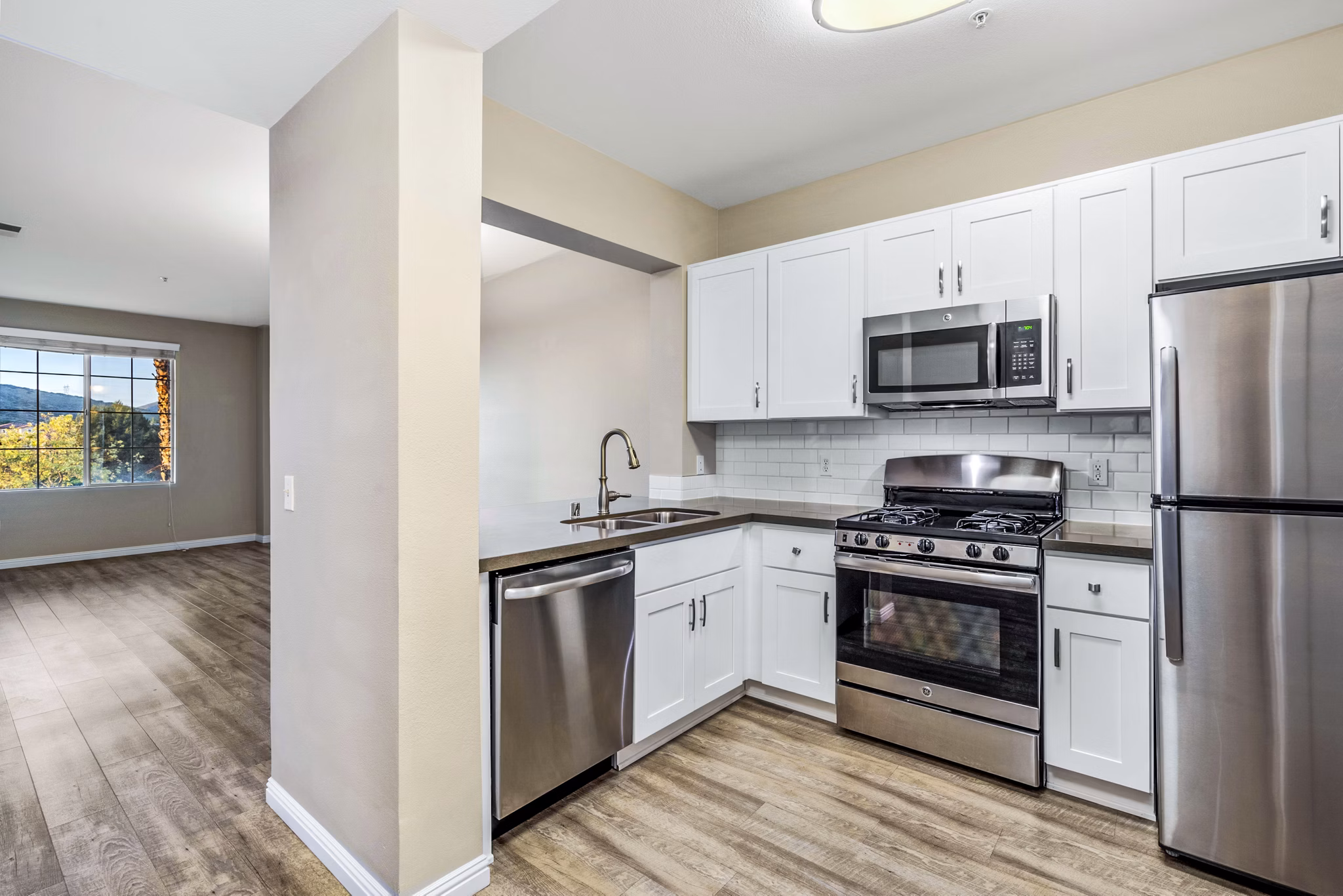 Modern kitchen with stainless steel appliances at Rolling Hills Gardens Apartments