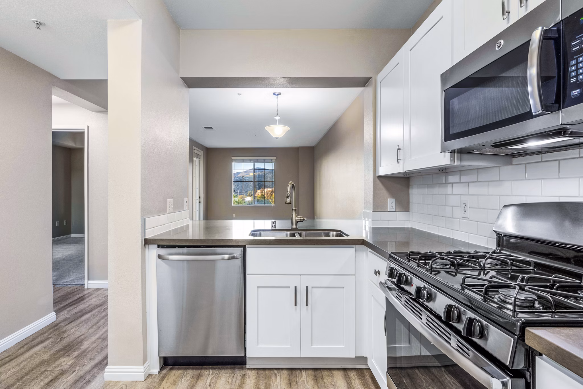 Modern kitchen featuring stainless steel appliances in Rolling Hills Gardens Apartments