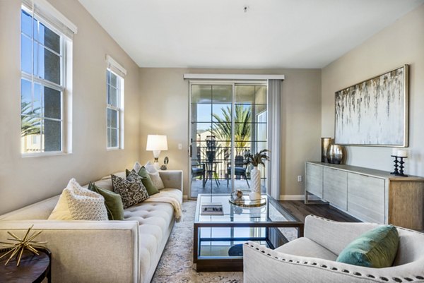 Spacious living room with modern furnishings at Rolling Hills Gardens Apartments, perfect for luxury living in a Greystar community