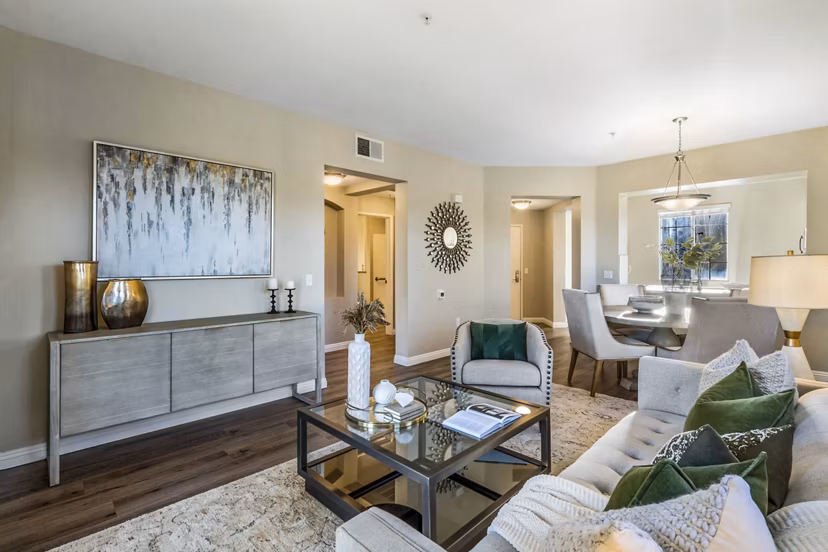 Spacious living room with plush seating and modern decor at Rolling Hills Gardens Apartments, offering luxury living and comfort