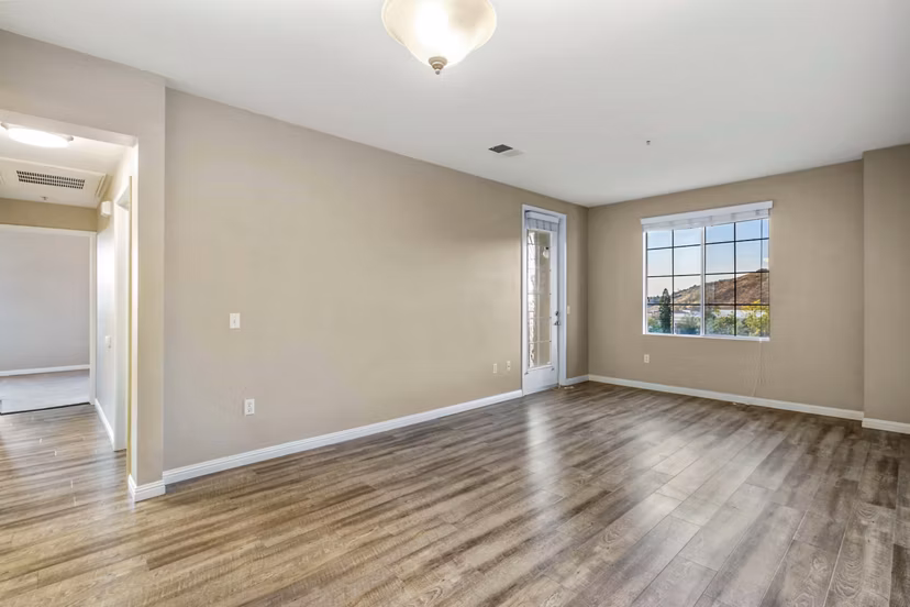 Spacious living room with modern furnishings at Rolling Hills Gardens Apartments