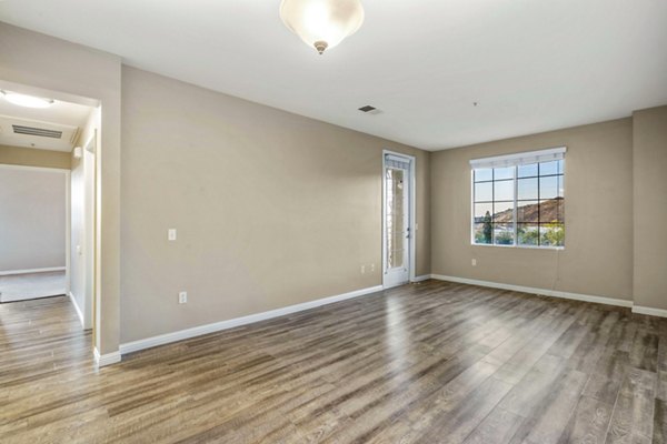 Spacious living room with modern furnishings at Rolling Hills Gardens Apartments