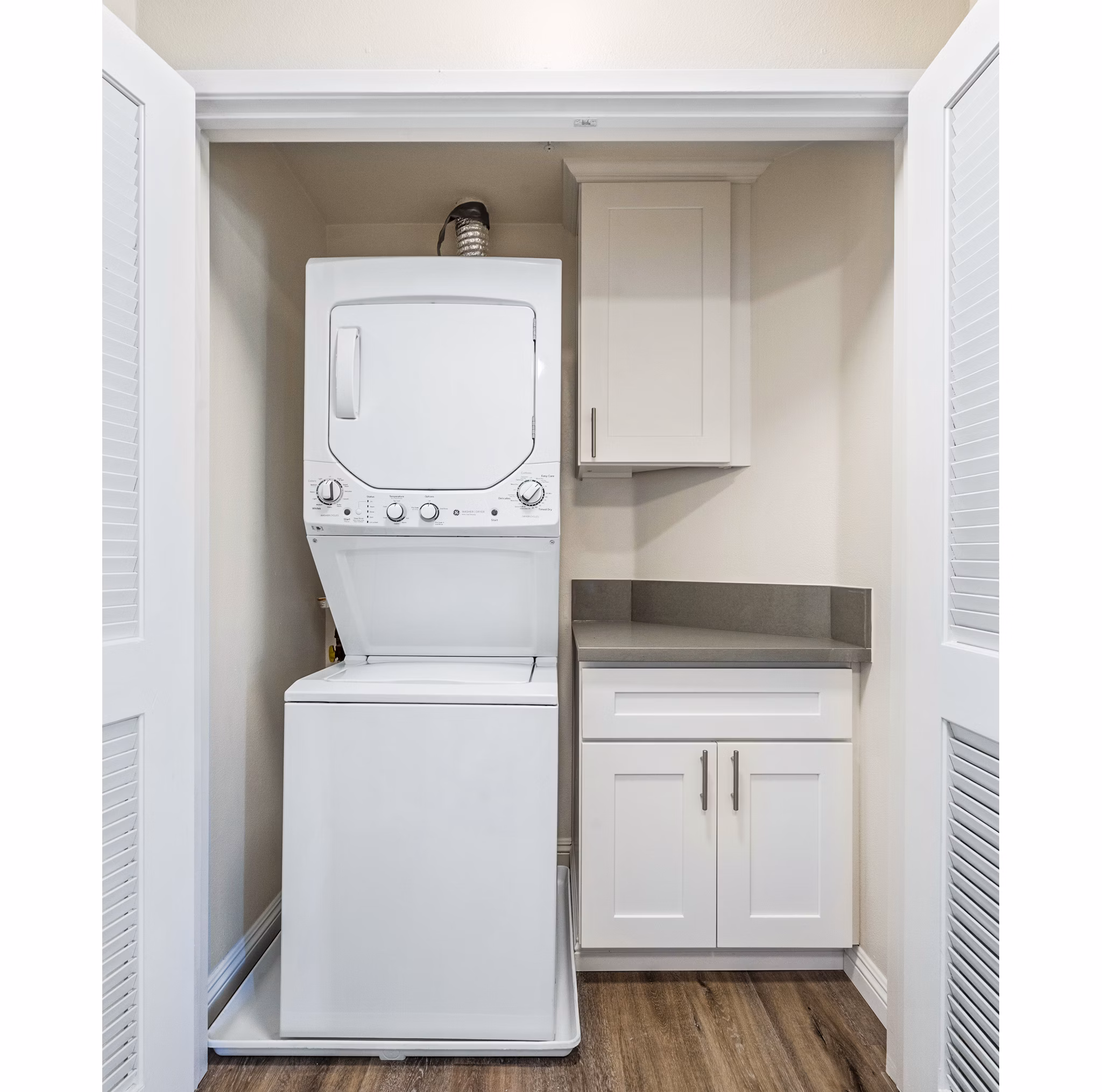 Laundry room with modern appliances at Rolling Hills Gardens Apartments