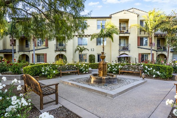 Courtyard with lush greenery at Rolling Hills Gardens Apartments