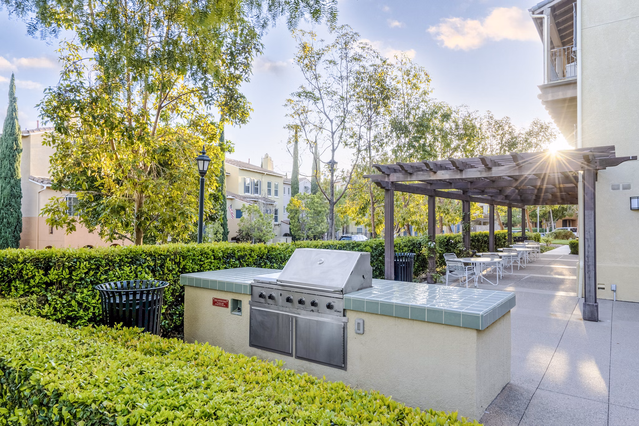 Outdoor grill area with modern amenities at Rolling Hills Gardens Apartments, perfect for social gatherings and entertaining