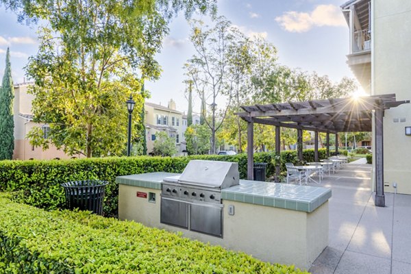 Outdoor grill area with modern amenities at Rolling Hills Gardens Apartments, perfect for social gatherings and entertaining