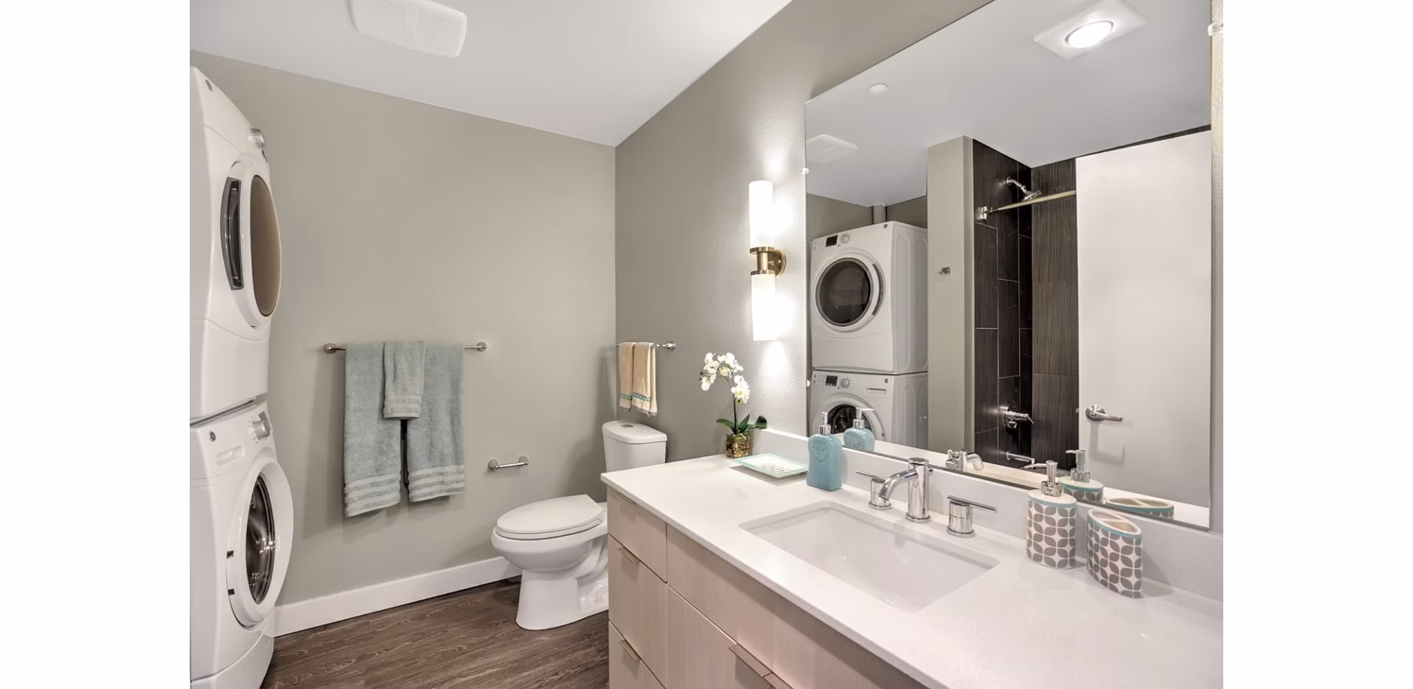 Modern bathroom featuring sleek fixtures and glass shower at Link Apartments luxury living