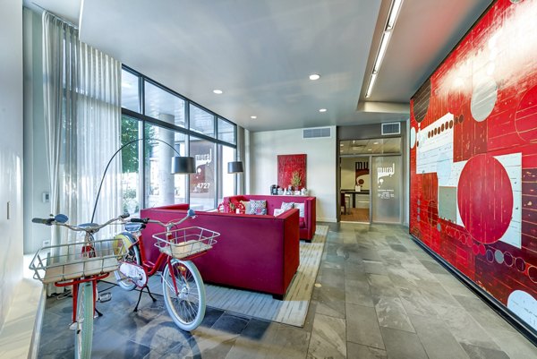 Luxury clubhouse with spacious lounge and modern design at Link Apartments, perfect for social gatherings and relaxation