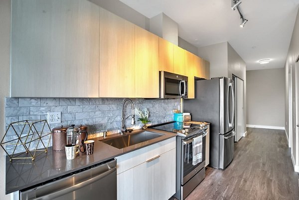Modern kitchen with stainless steel appliances at Link Apartments, Greystar luxury apartments