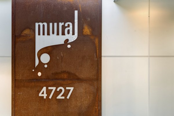 Signage at Mural Apartments: Elegant outdoor entry with modern design elements promoting luxury living