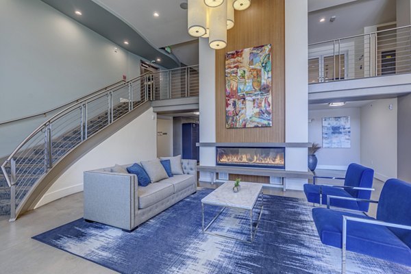 Lounge area with contemporary seating and decor in the Prescott Apartments clubhouse