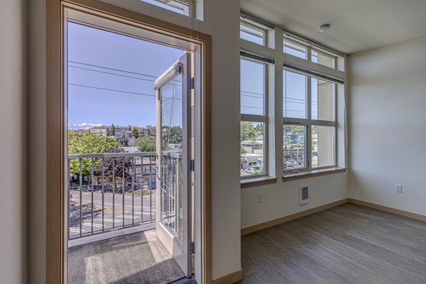 Spacious living room with elegant furnishings and natural light in Prescott Apartments